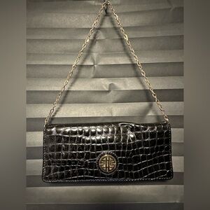 Black crocodile-embossed leather clutch by the brand Antonio Melani.